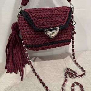 Knitted crossbody bag in Burgundy shade with black handcrafted details